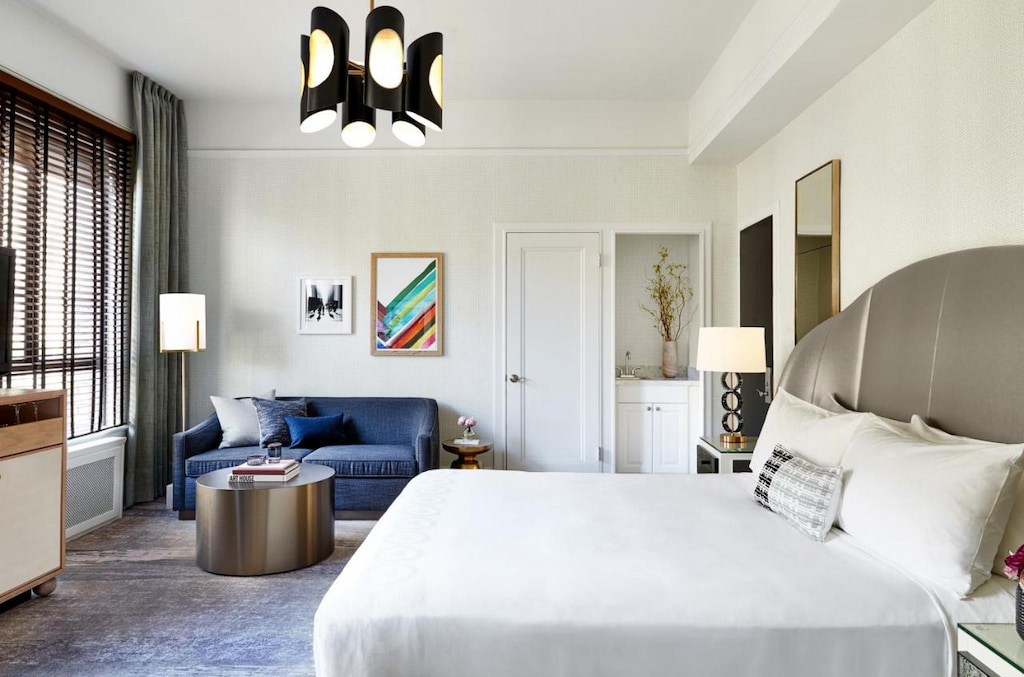 the best hotel in San Francisco with a king-size bed with white sheets near the blue couch in the corner of the room 