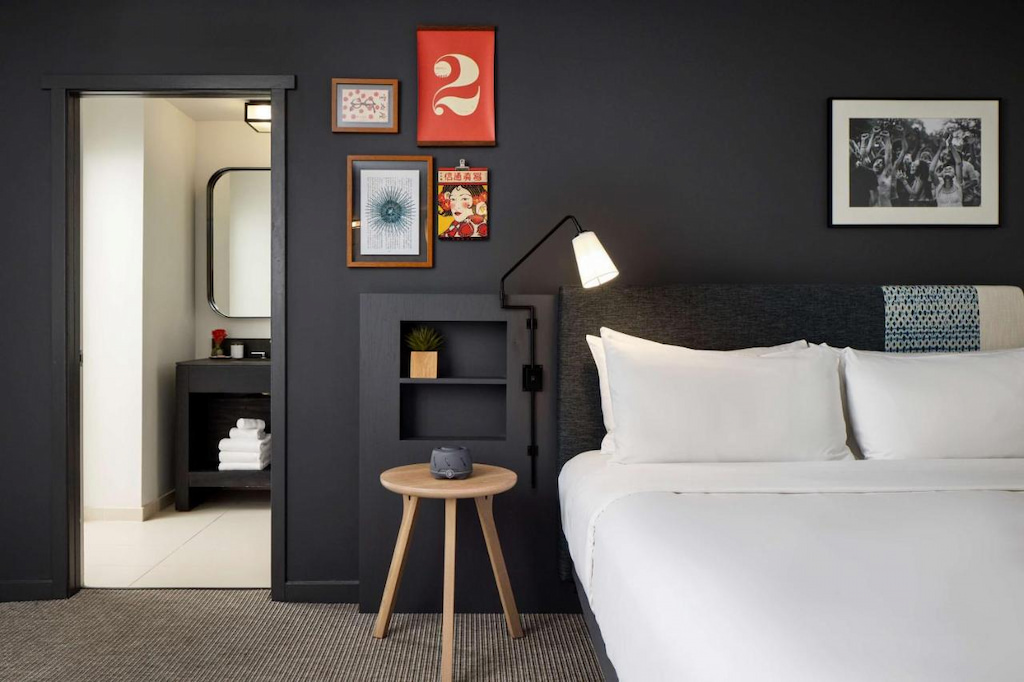 the coolest hotels in San Francisco with black wall room and elegant furniture.