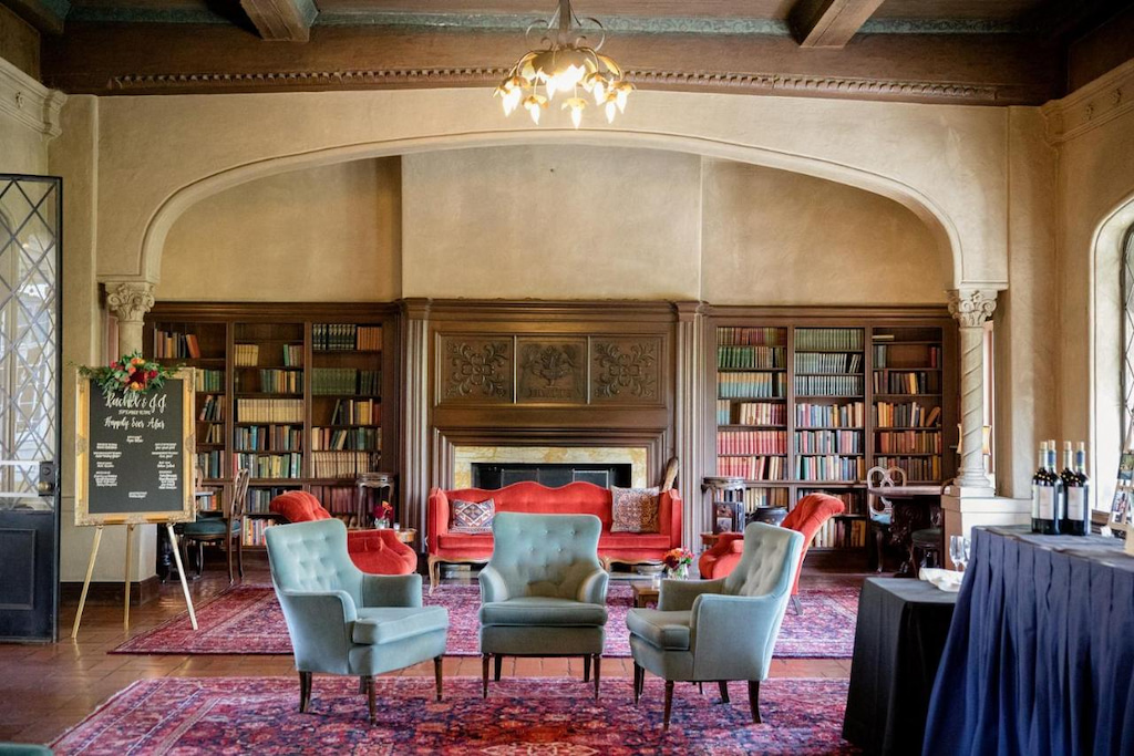 The best hotel in Berkeley with a room with bookshelves, fireplace, sofa, chairs, carpets, and chandelier