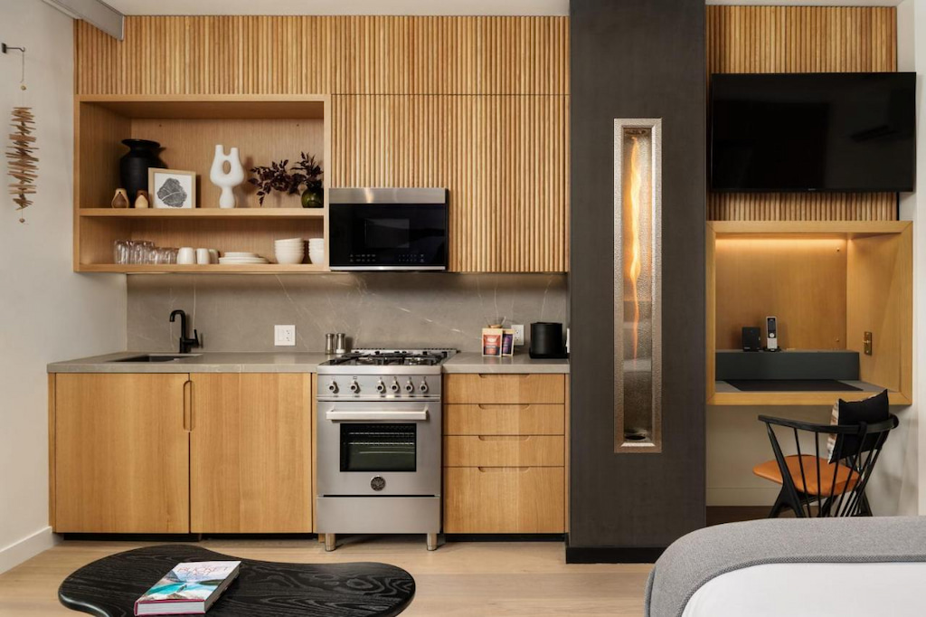 hotel kitchenette with gray and wood accents