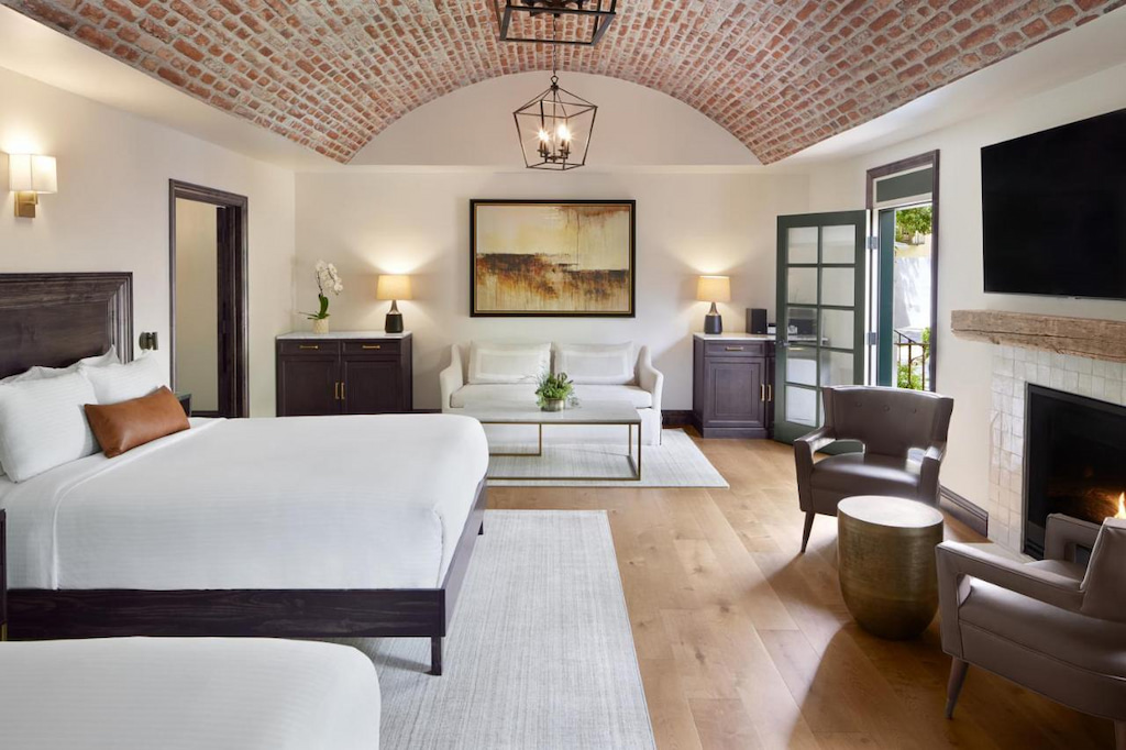 designer boutique hotels in Northern California with red brick curved ceiling and modern white furnishings
