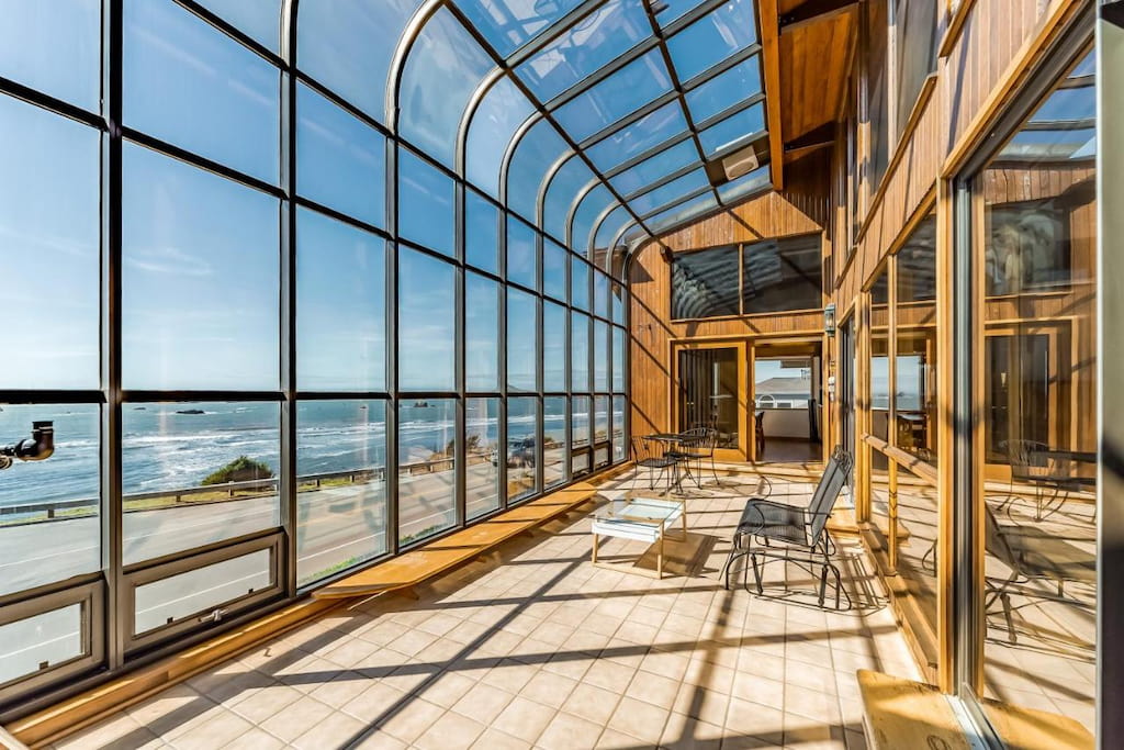 ceiling-to-floor windows and perfect view of the ocean from the hotel