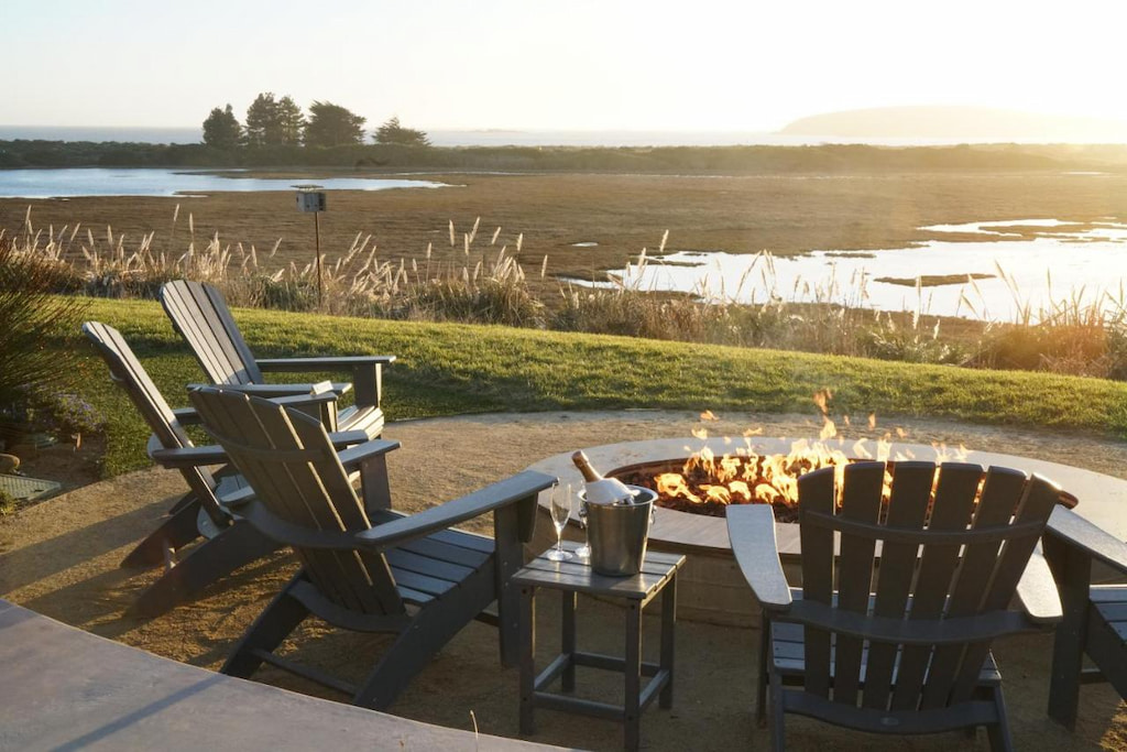 best boutique hotels on the Northern California coast with luxury fire pit overlooking grasslands along the ocean