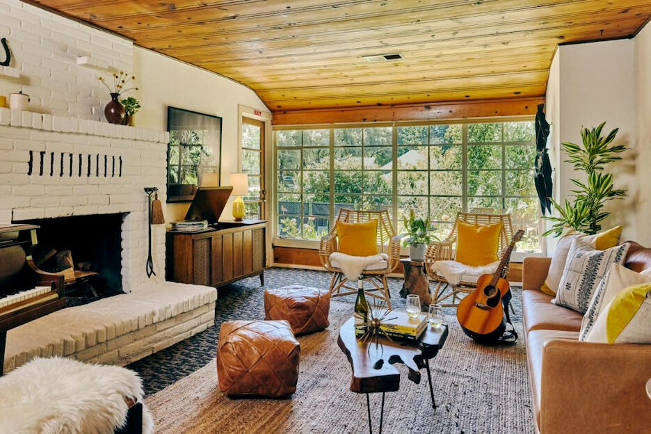 best boutique hotels in Guerneville CA Russian River Valley with brown leather stools, fireplace and wood ceiling