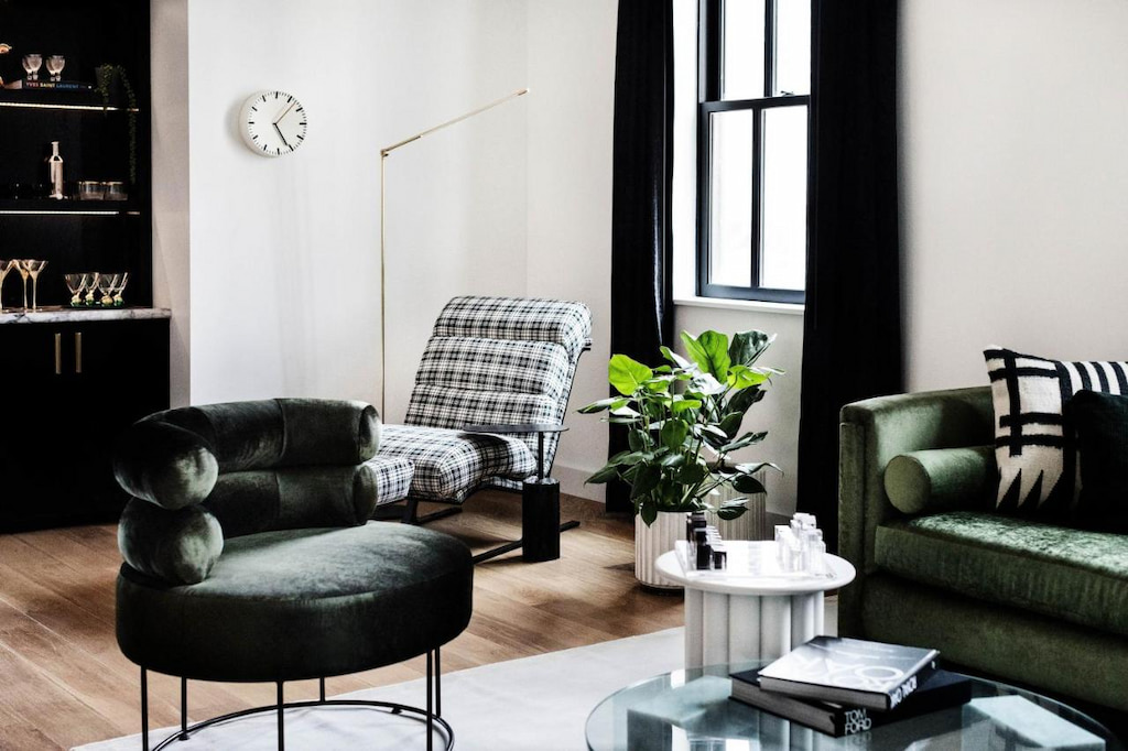 dark green and black and white plaid furnishings adorn a boutique hotel in San Diego California